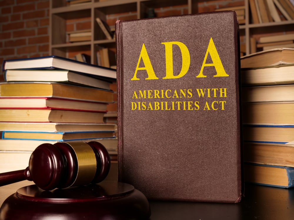 Gavel and Americans with Disabilities Act ADA book with documents.